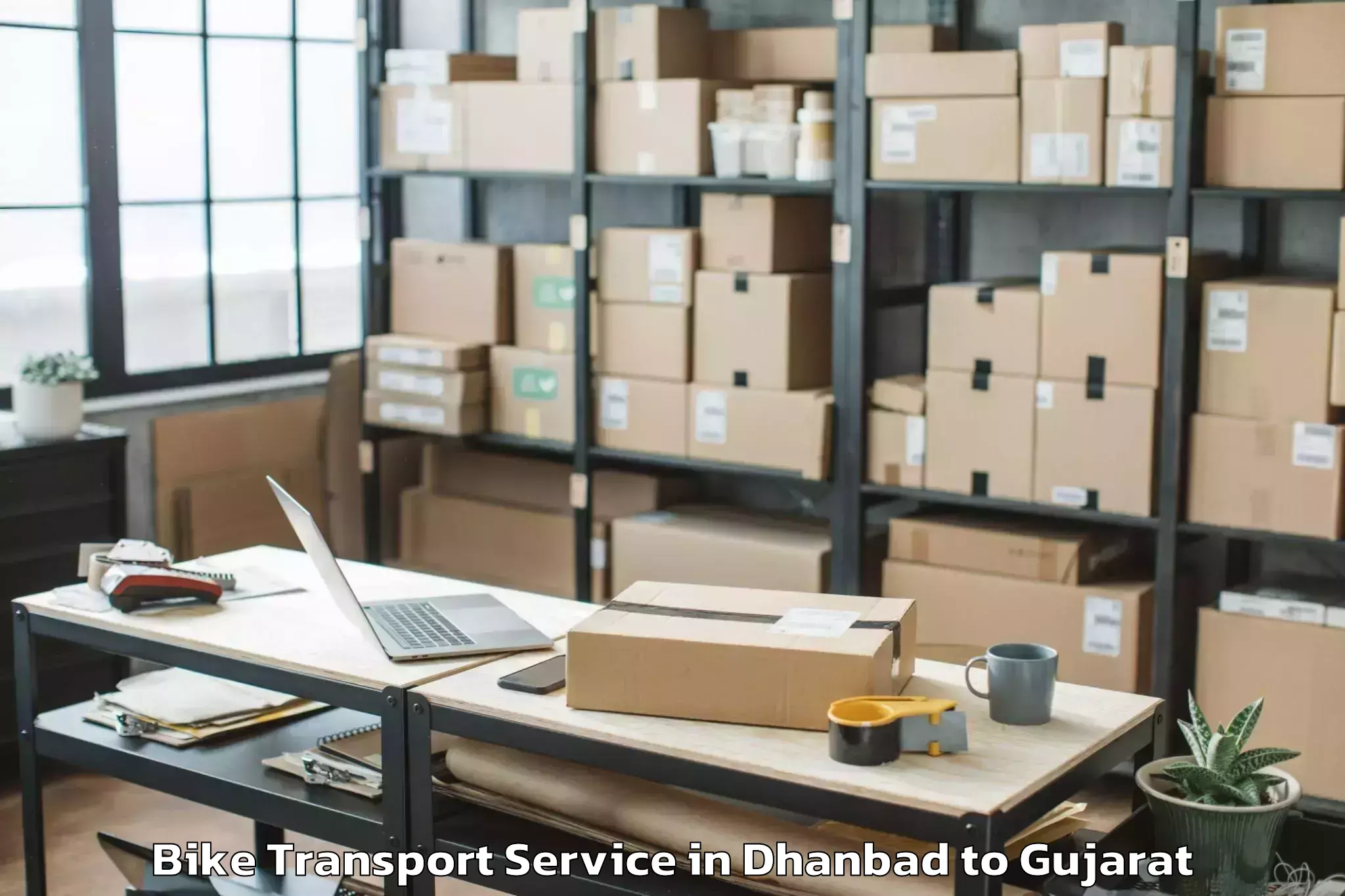 Book Your Dhanbad to Gujarat National Law Universit Bike Transport Today